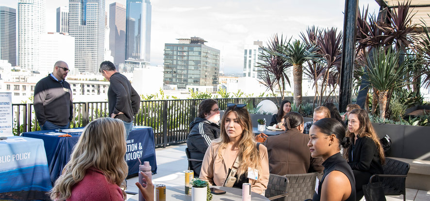 group discussion with LA buildings in the background